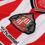 Close-up of a red-and-white Sunderland AFC jersey featuring the club crest and Hummel logo.