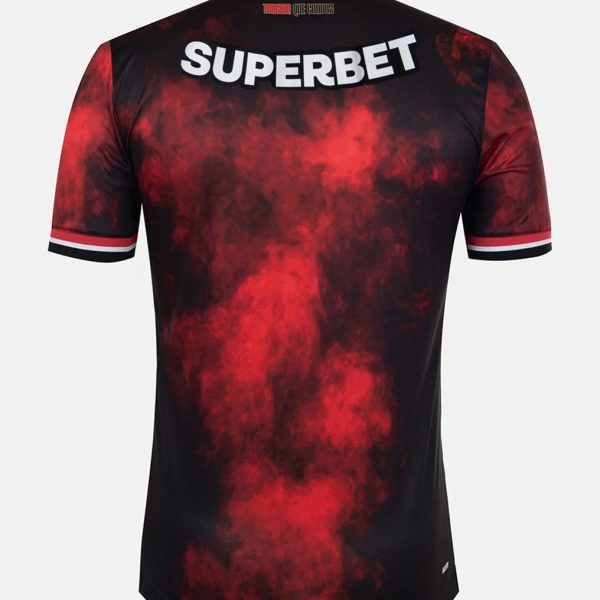 Back view of a black and red smoky-pattern jersey with the word 'SUPERBET' across the shoulders.