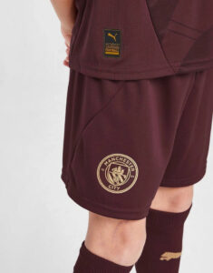 Maroon Manchester City football shorts with team crest and an authentic licensed football patch on the side, worn with matching socks.