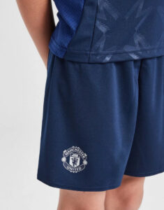 Navy athletic shorts with a Manchester United crest on the left leg.