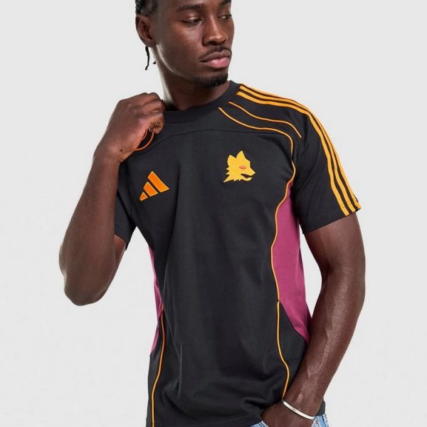 Male model wearing a black athletic jersey with orange shoulder stripes, pink side panels, and a yellow wolf emblem on chest.