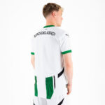 Rear view of a man wearing a white Borussia Mönchengladbach football jersey with green cuffs and an arched club name on the back.