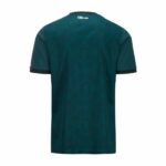 Back view of a teal short-sleeve shirt with black sleeve cuffs and a small white '100 YEARS' logo near the neckline.