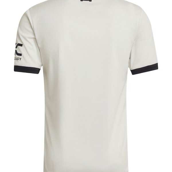Back view of a white short-sleeve athletic jersey with black sleeve cuffs and a small brand tag at the upper back.