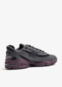 m1000eb-052_6 | UAE SPORT STORE New Balance 1000 athletic sneaker in gray and black with a purple sole and side N logo.