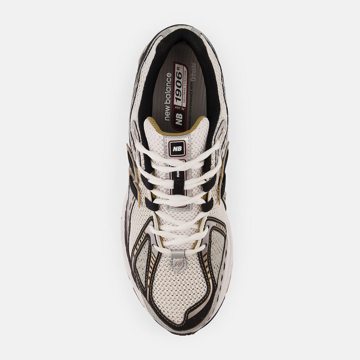 Top-down view of a beige and black athletic sneaker with white laces and an NB logo on the tongue area