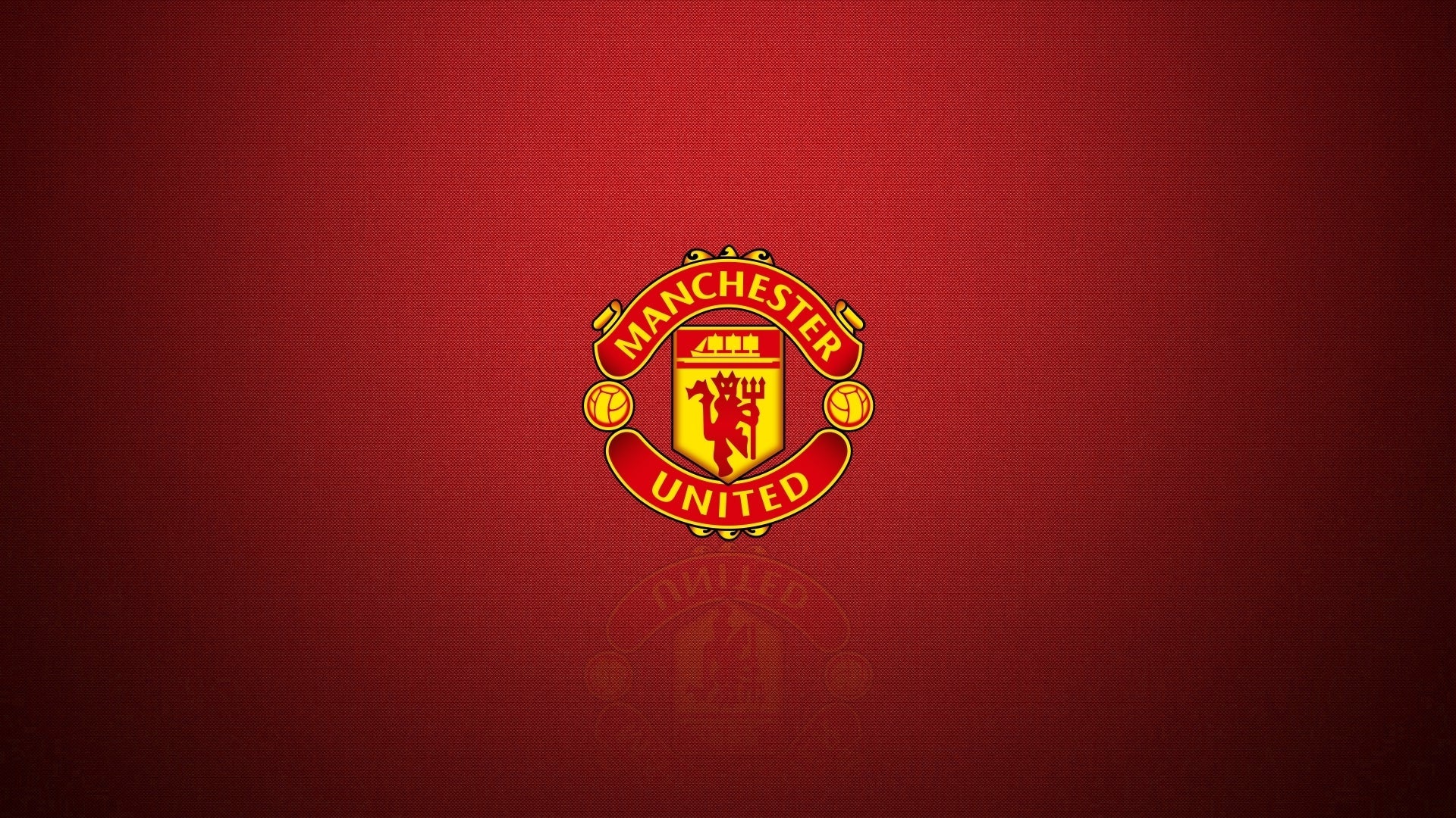 Manchester United crest centered on a dark red textured background with a gold banner and shield motif
