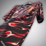 Black jersey with a red and white flame pattern on a hanger; Adidas logo visible on the chest area.