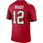 Back view of a red jersey with the name BRADY and the number 12 in white with orange/black outline