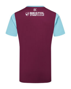 Back view of a maroon short-sleeve sports jersey with light blue sleeves and the Bristol Street logo on the upper back