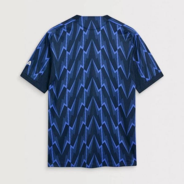 Back view of a dark blue short-sleeve T-shirt with a bright blue zigzag chevron pattern.