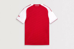 Back view of red Arsenal football jersey with white sleeves and 'Arsenal' logo at the neck.