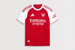 Arsenal red home football jersey with white sleeves, crest, and Emirates Fly Better sponsor on the front