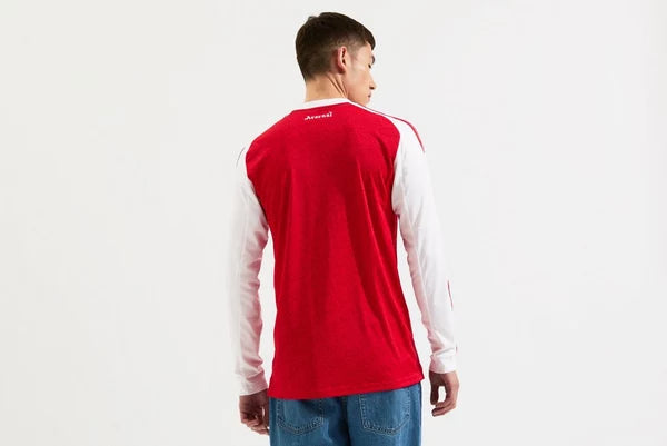 mji9536_b | UAE SPORT STORE Back view of a person wearing a red long-sleeve shirt with white sleeves, standing against a white background.