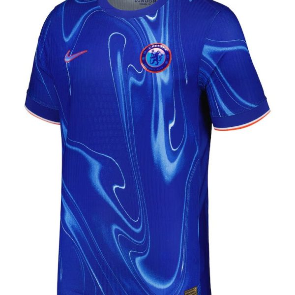 Chelsea FC blue home jersey featuring a swirling light-blue abstract pattern, with Nike swoosh on the right chest and the Chelsea crest on the left chest, orange-trim sleeves.