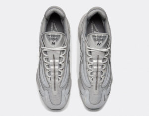 Top-down view of two gray New Balance 1000 sneakers side by side with laces tied.