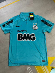 Turquoise Santos FC soccer jersey with Banco BMG sponsor and Nike logo, tag attached on the collar.