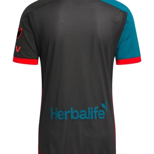 Back view of a black Herbalife-sponsored athletic jersey with teal right sleeve and red trim at cuffs and hem.
