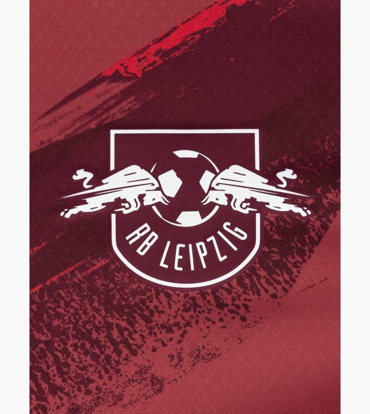 RB Leipzig club crest with two white charging bulls facing each other around a circle inside a shield on a textured red background