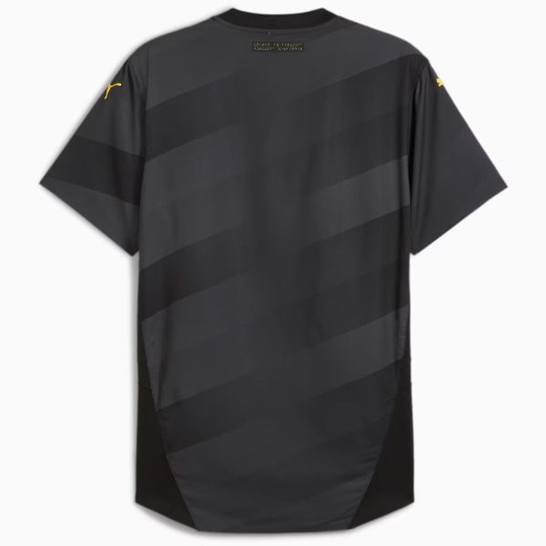 Back of a dark gray striped jersey with short sleeves and yellow brand logos on the sleeves; tag at upper back.