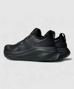 Pair of black athletic sneakers with thick, sculpted sole and subtle branding on the side ready for running or training