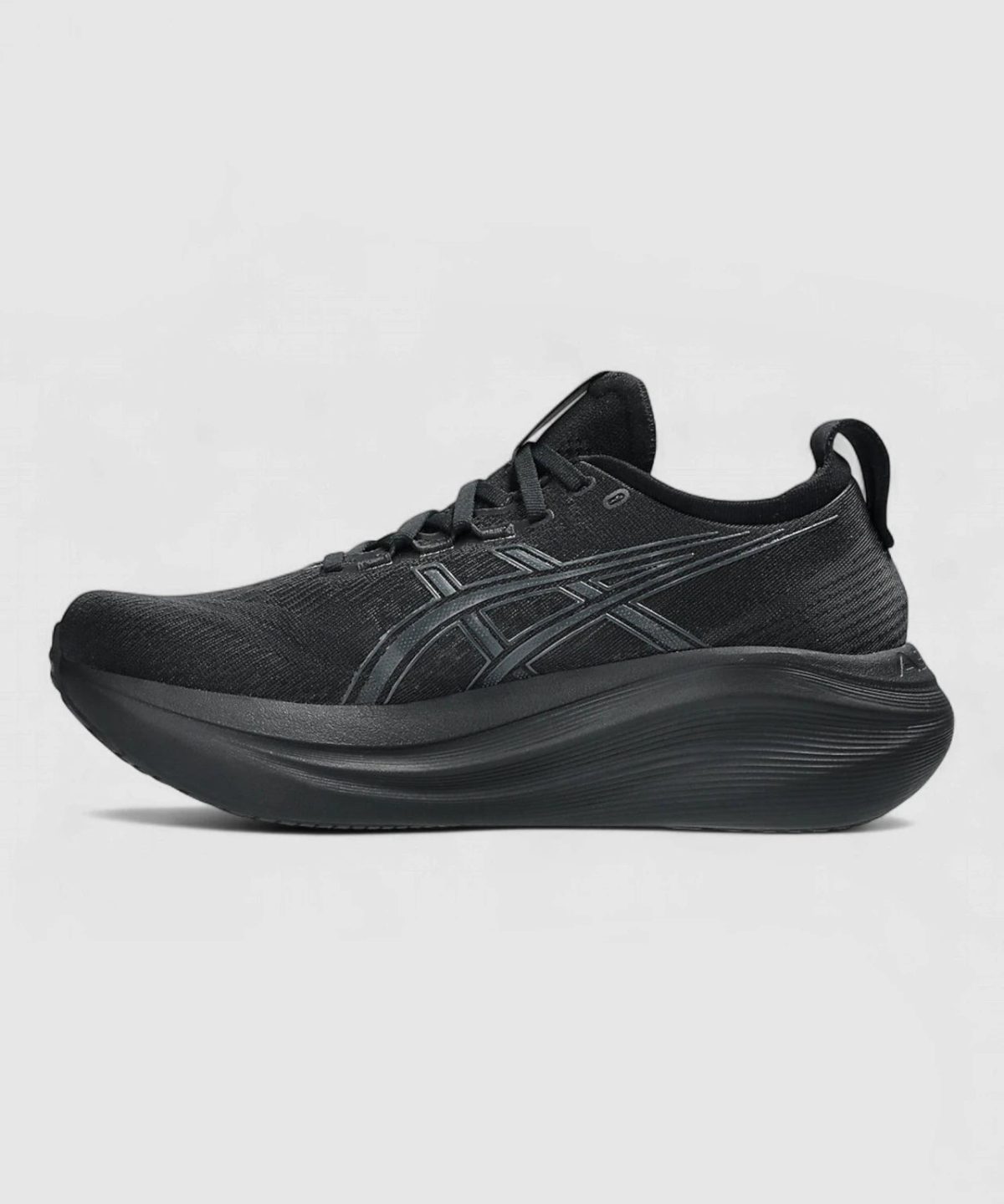 Side view of a black running shoe with a thick curved midsole and subtle side stripes