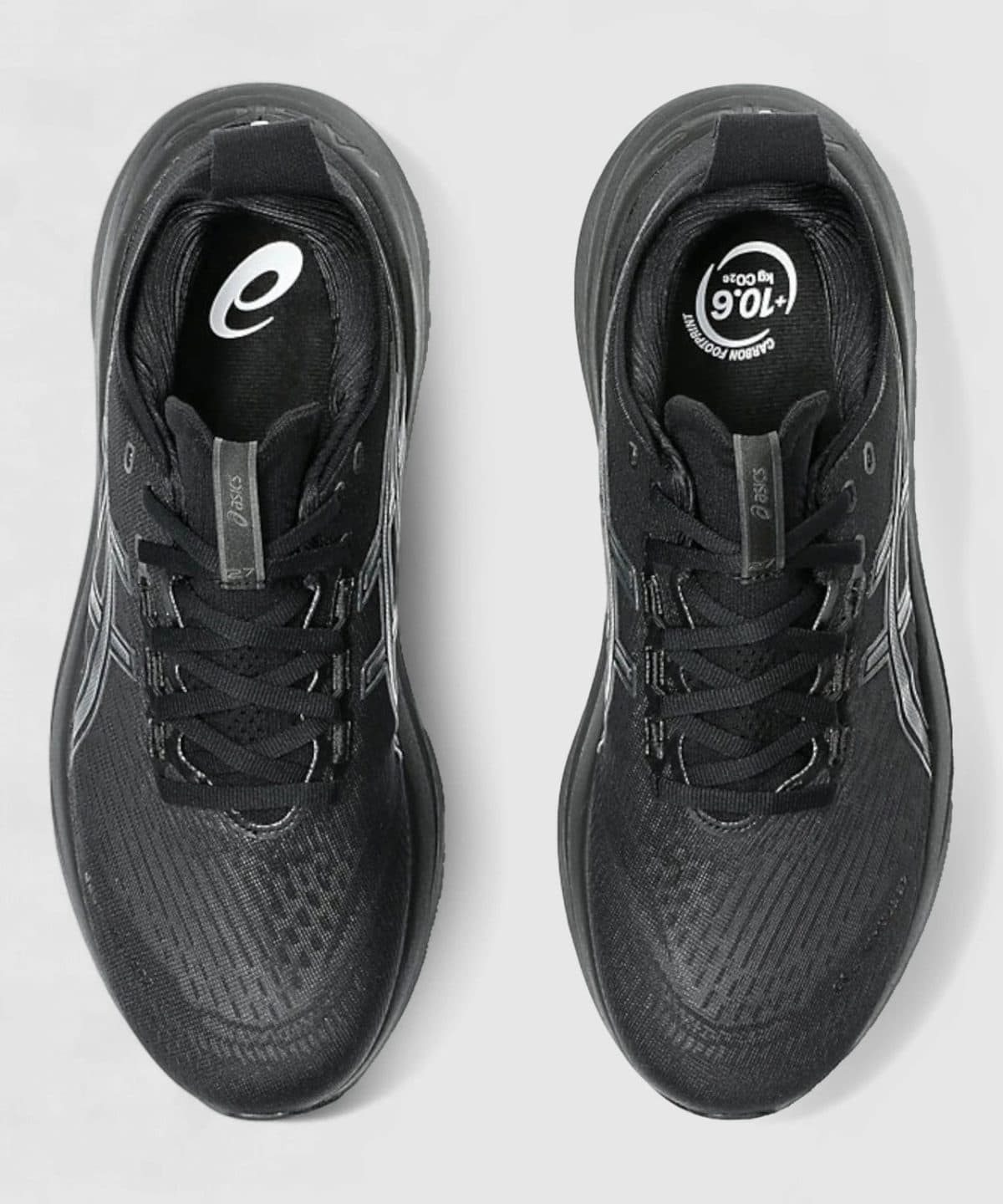 Pair of black running shoes viewed from above, laces tied, with Asics branding on the tongues.