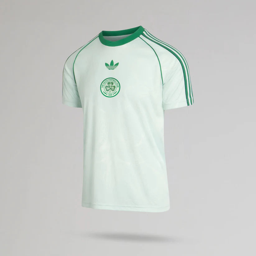 p-12932-b | UAE SPORT STORE Light green soccer jersey with dark green piping, three stripes on the shoulders, and a circular club crest on the chest.