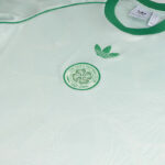 p-12932-e | UAE SPORT STORE Mint-green Celtic Football Club jersey with Adidas logo and club crest.