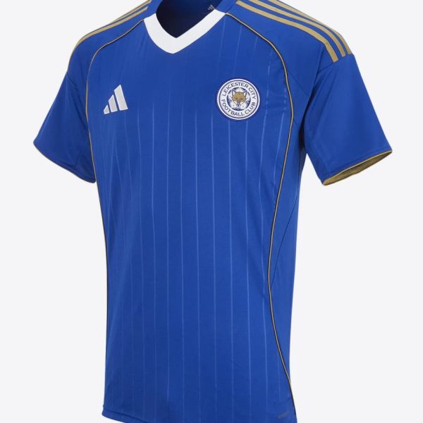 Blue Leicester City football jersey with gold Adidas stripes on shoulders and crest on chest