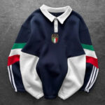 Navy rugby-style sweatshirt with white collar and Italian crest on the chest, sleeves featuring green, white, and red color blocks.