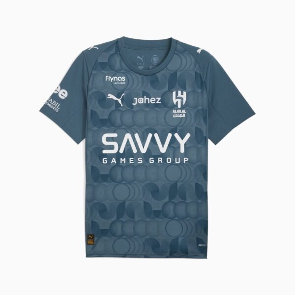 Blue-gray football jersey with a circular pattern, featuring the large 'SAVVY GAMES GROUP' logo centered on the chest and several sponsor logos (Puma, Jahez, Alhilal).