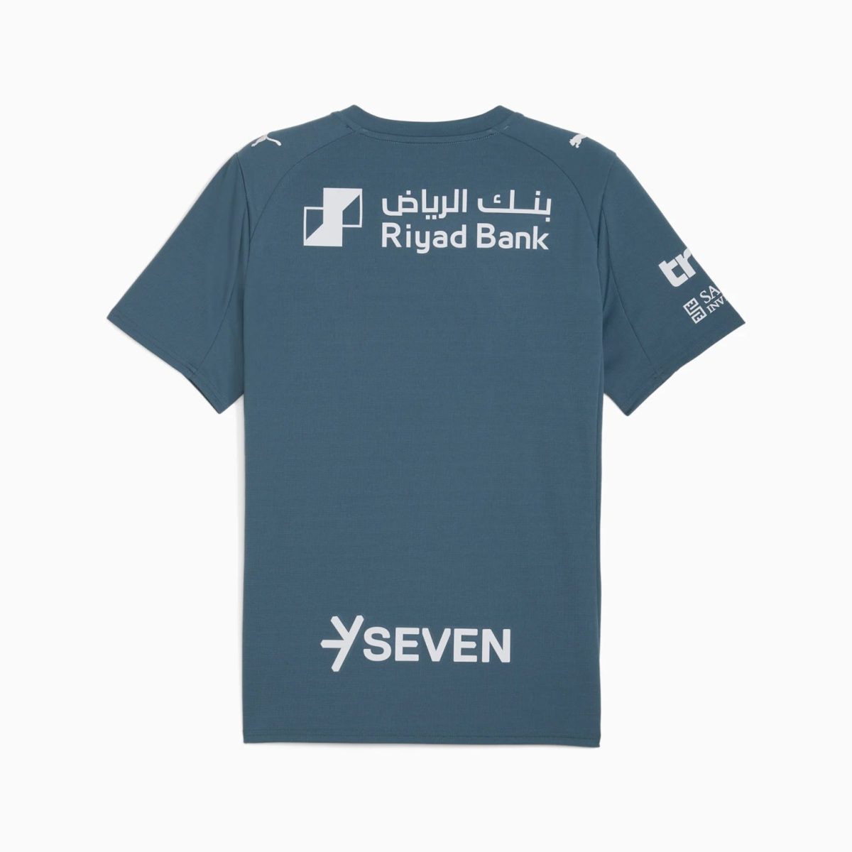 Blue T-shirt back displaying Riyad Bank logo in Arabic and English with sponsor logos on sleeve and lower back area