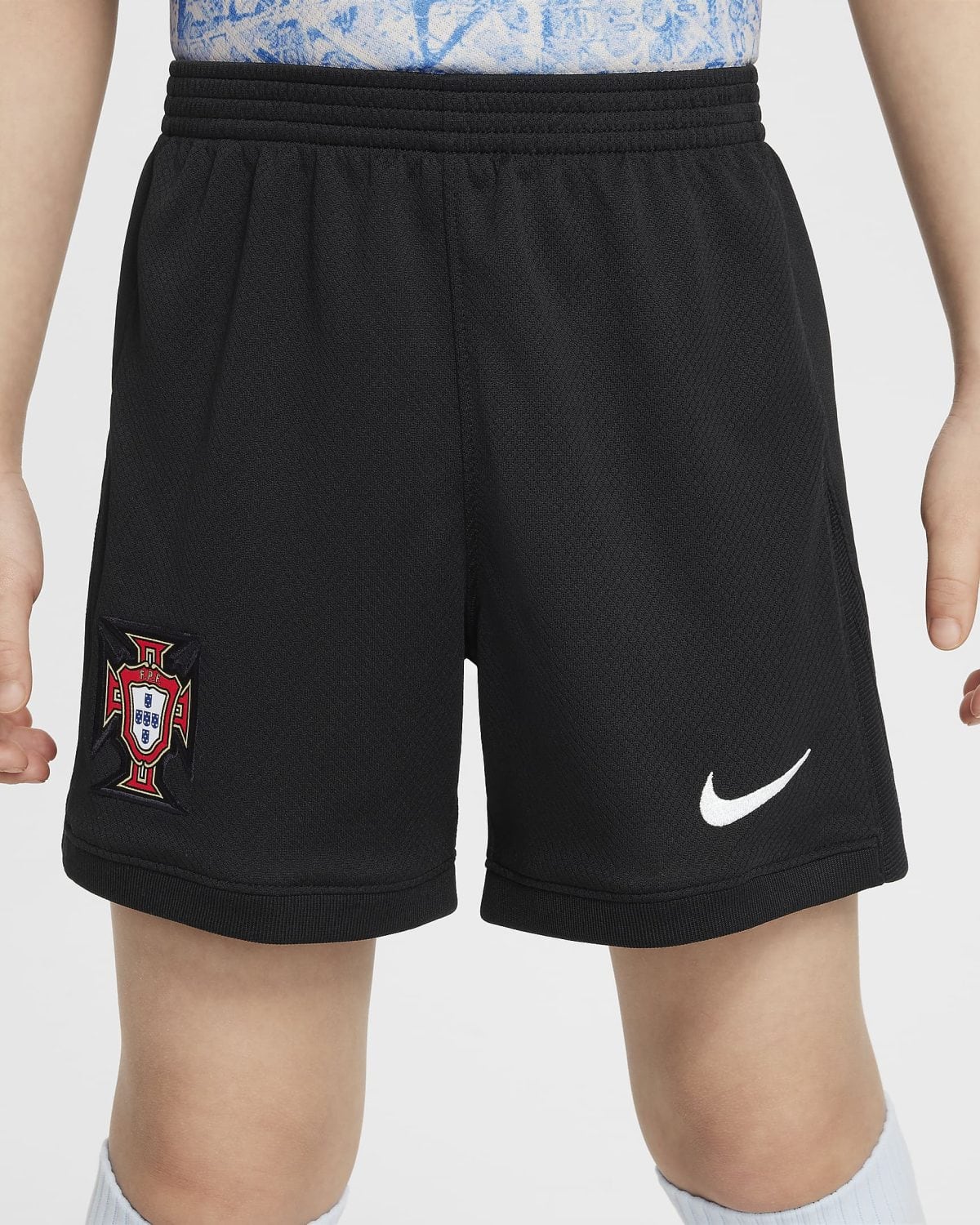 Black athletic shorts with Portugal crest on the left leg and a white Nike swoosh on the right leg.