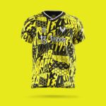 Bright yellow and black graphic soccer jersey with bold text patterns and a V-neck, featuring Hummel logo and 'Tezos' sponsor across the chest.