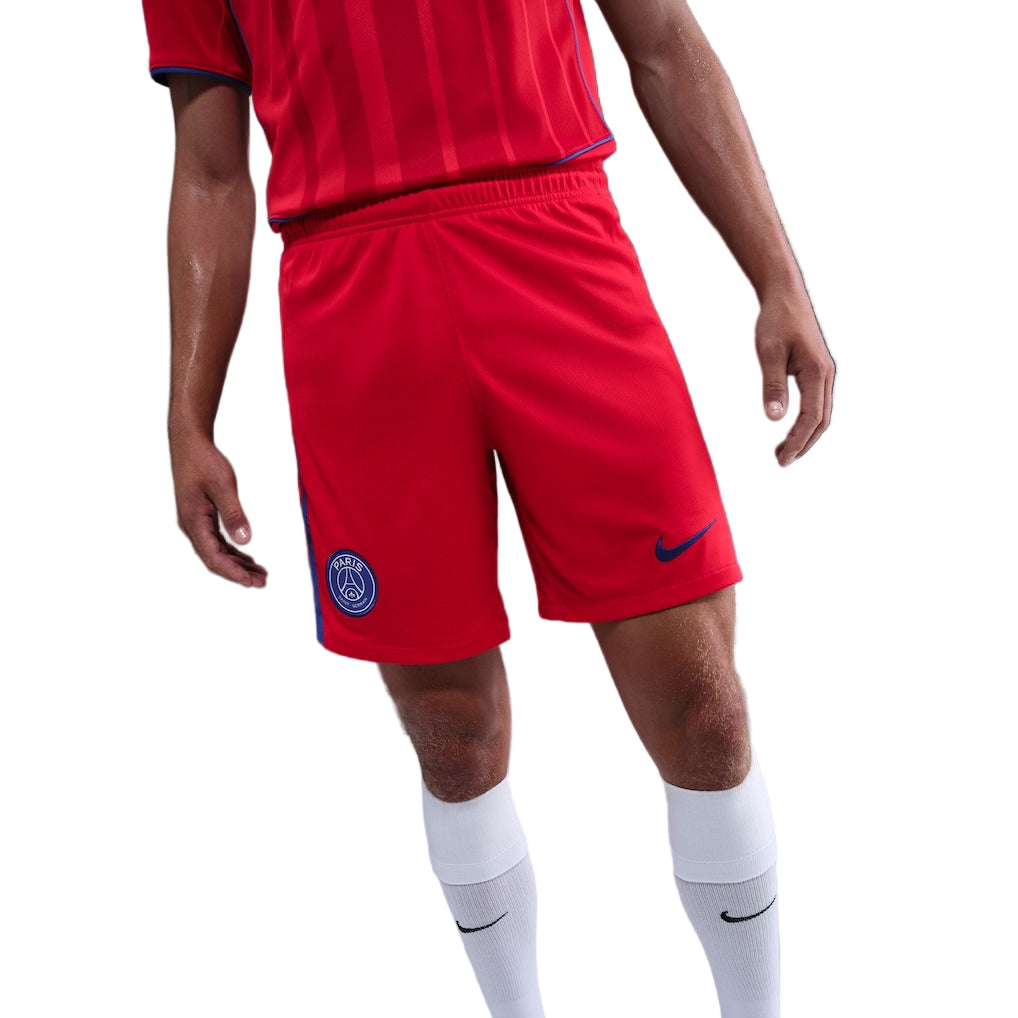 psg-nike-third-stadium-shorts-2025-26_ss5_p-202664109_pv-4_u-ymre64drzy3cnmkd95zw_v-mghch4cnry4tehgrkzm4 Soccer player in red PSG shorts with the club crest on the left leg and a blue Nike logo, wearing white socks.