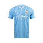 Light blue Manchester City away jersey with white pinstripe pattern, Puma logo, club crest, and Etihad Airways sponsor.