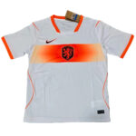 qc-netherlands-away-2026-world-cup-jersey-fan-version-from-v0-pa3wbfh4e0og1 | UAE SPORT STORE White Netherlands soccer jersey with orange chevron stripe across the chest, black Nike swoosh, and orange-trimmed sleeves and collar.
