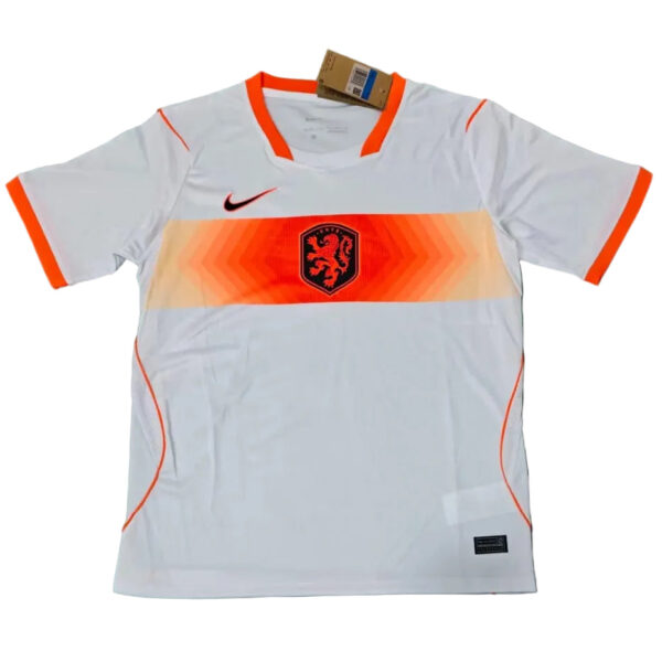 White Netherlands soccer jersey with orange chevron stripe across the chest, black Nike swoosh, and orange-trimmed sleeves and collar.