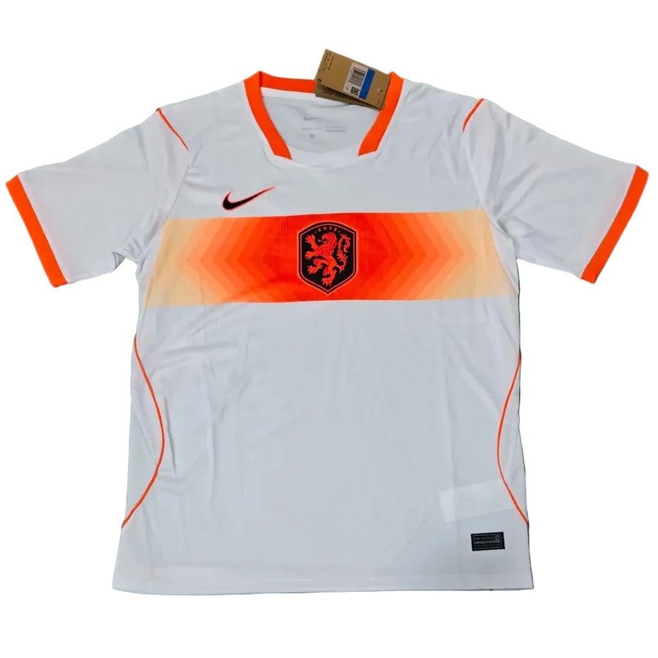 qc-netherlands-away-2026-world-cup-jersey-fan-version-from-v0-pa3wbfh4e0og1 White Netherlands soccer jersey with orange chevron stripe across the chest, black Nike swoosh, and orange-trimmed sleeves and collar.
