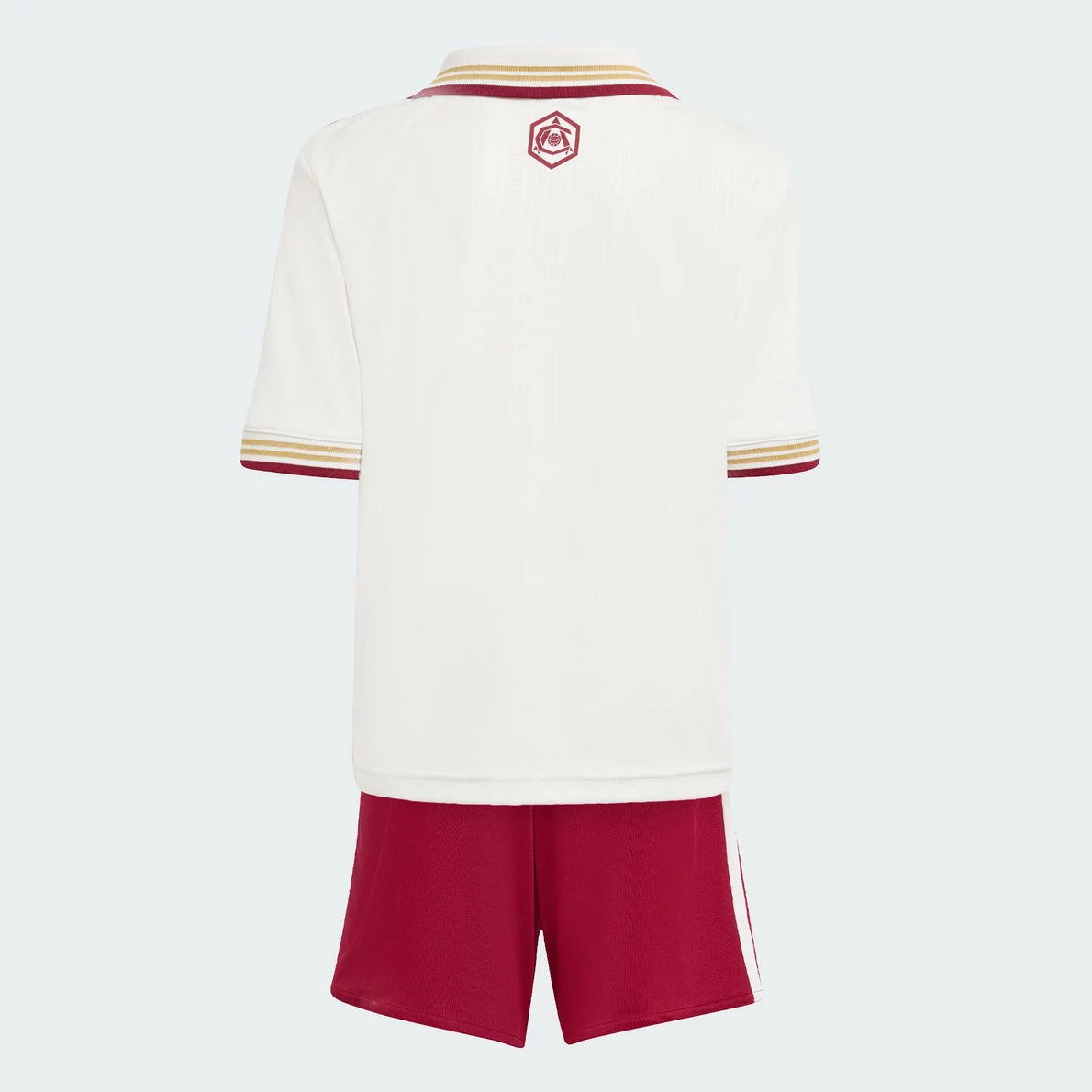 r4 | UAE SPORT STORE Back view of a white sports jersey with maroon and gold striped collar and sleeve cuffs, a small crest on the upper back, paired with red shorts.