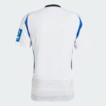 Back view of a white soccer jersey with blue side panels and a black collar. A subtle grid pattern runs along the lower back hem.