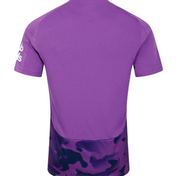 Back view of a purple athletic jersey with a dark purple camo-pattern hem at the bottom.