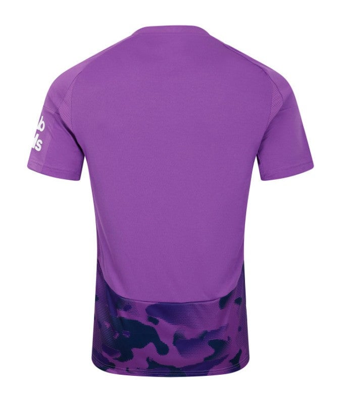 rDgrBMYyK9KWFpE | UAE SPORT STORE Back view of a purple athletic jersey with a dark purple camo-pattern hem at the bottom.