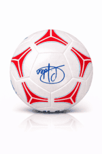 White soccer ball with red angular patterns and a blue signature on the center panel against a white background