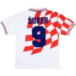 rn-image_picker_lib_temp_0c402335-5fe8-4849-86ef-18979eb333a1 | UAE SPORT STORE White soccer jersey with blue number 9 and the name ŠUKER on the back, featuring a red-and-white checkered pattern.
