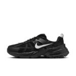 Black Nike running shoe with a chunky sole and white swoosh viewed from the side