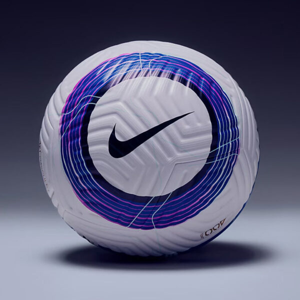 White Nike soccer ball with a purple-blue circular swirl pattern, resting on a dark gradient background.