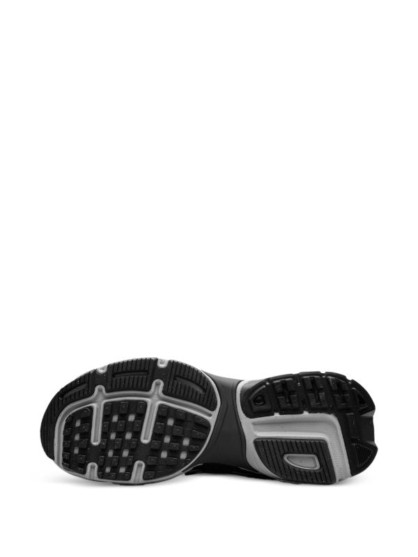 rn-image_picker_lib_temp_1fbbcc6f-9c89-468b-9cac-1dfd8af28f57 | UAE SPORT STORE Bottom view of a black and gray athletic shoe sole, showing its tread pattern and grip.