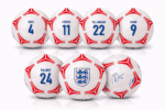 Row of white footballs with red geometric patterns displaying player names and numbers: Rice 4, Foden 11, Bellingham 22, Kane 9, Palmer 24, plus an England crest ball and a signed ball (bottom row).